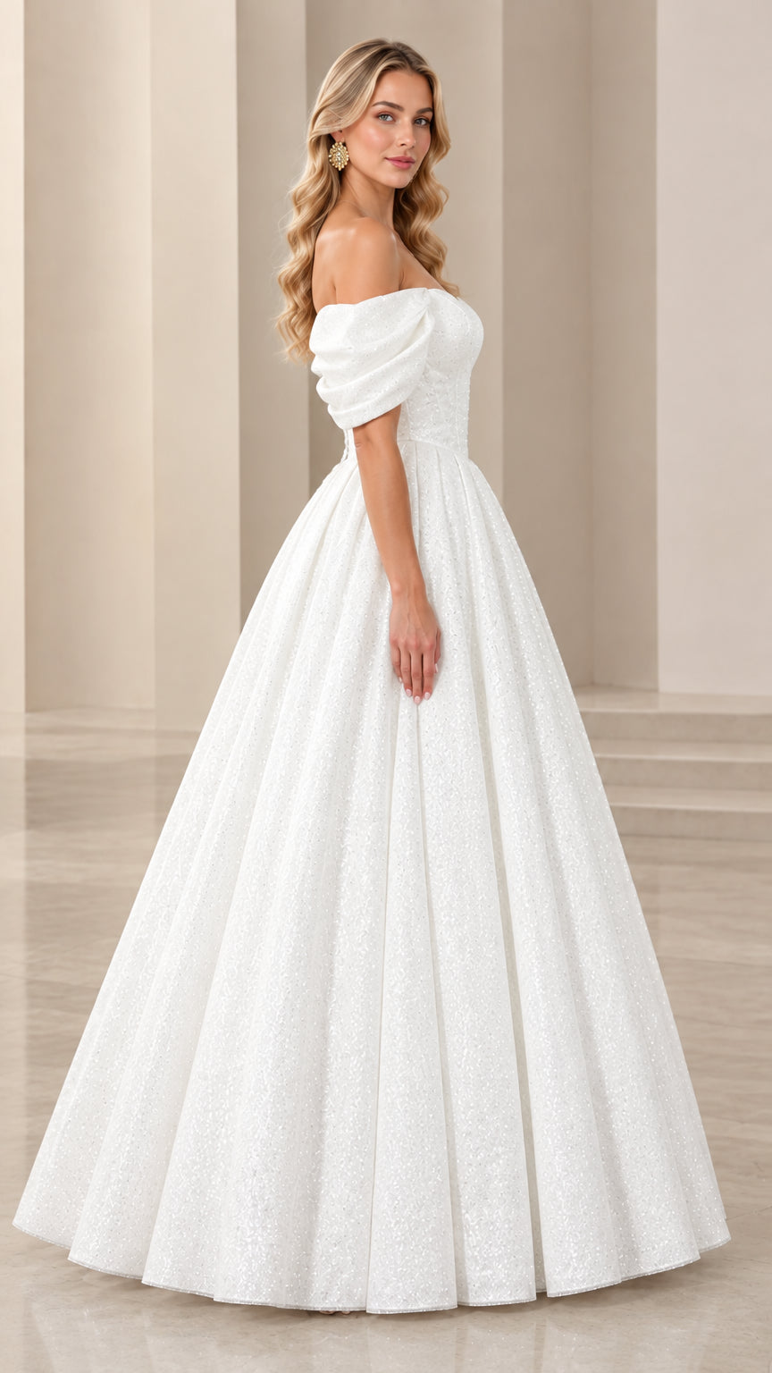 Side profile of white sparkly ball gown highlighting full pleated skirt and puff sleeves