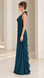 Side profile view of teal blue ruched halter evening dress showing fluid drape