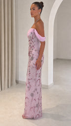 Side view of model wearing pink floor-length beaded formal dress