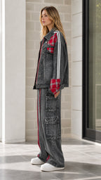 Side profile of model in Washed Black denim set highlighting sleeve graphic and utility cargo pockets