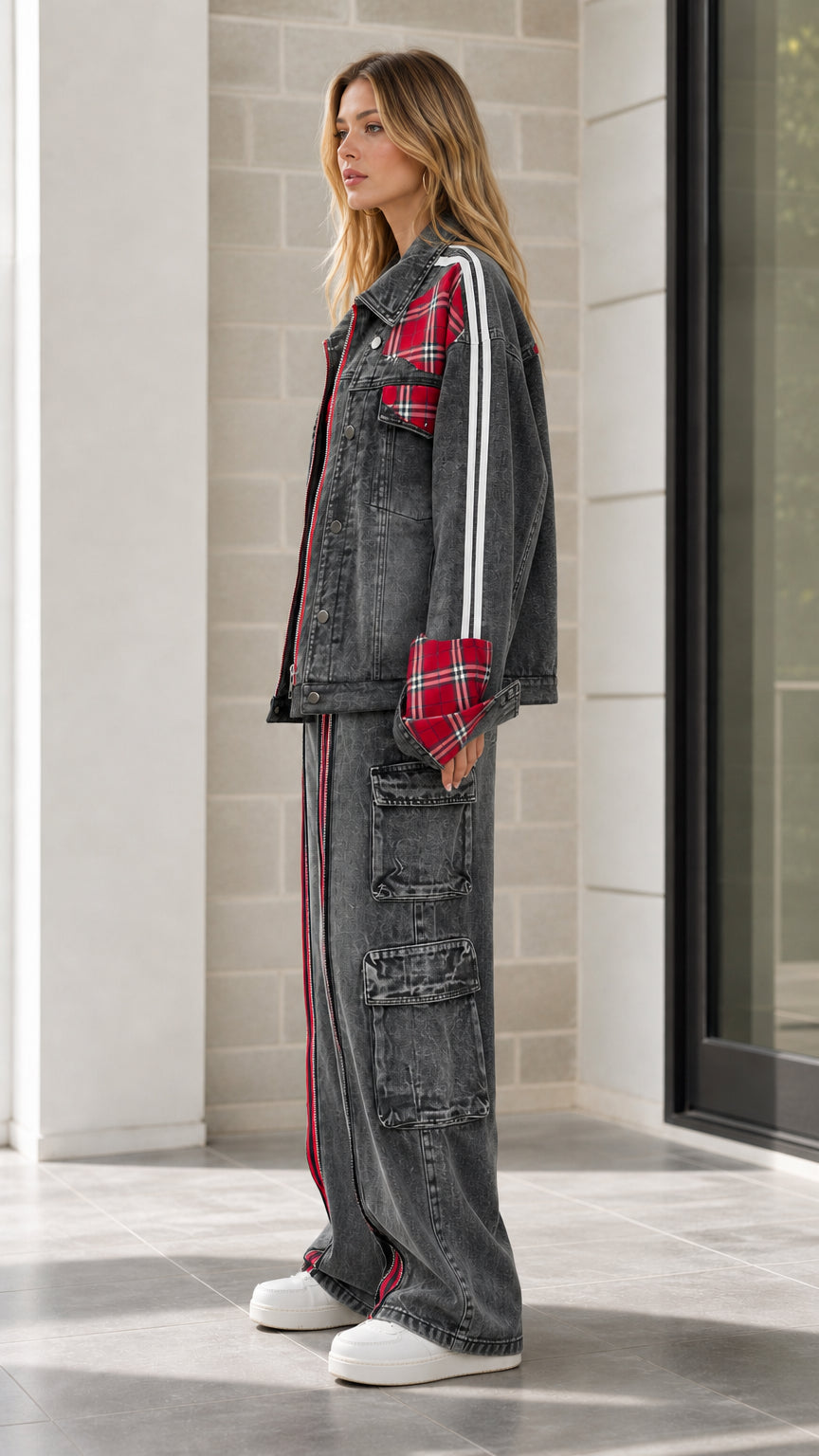 Side profile of model in Washed Black denim set highlighting sleeve graphic and utility cargo pockets