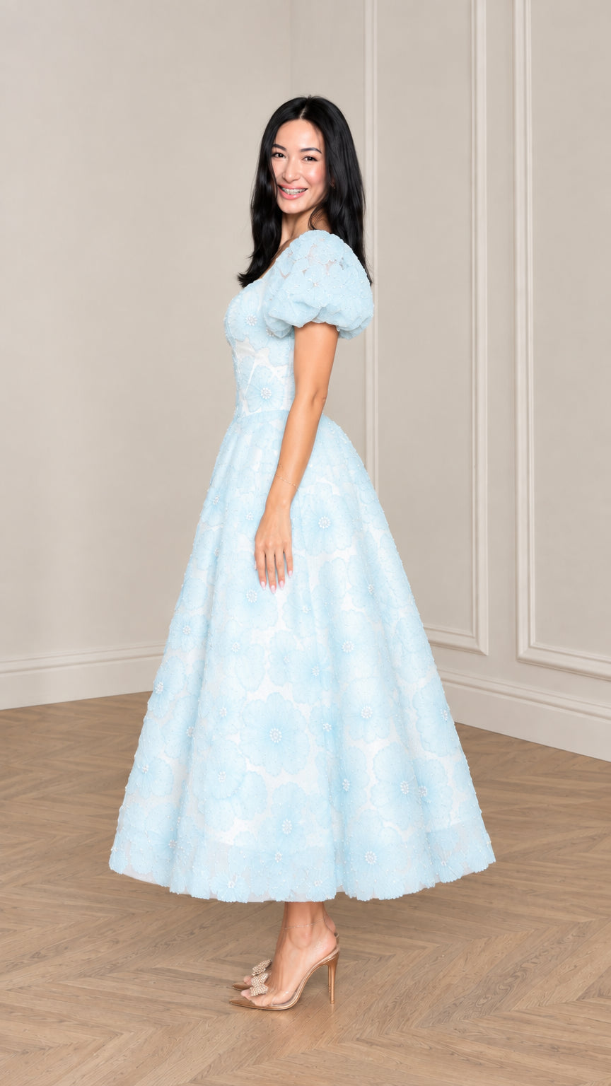 Side profile view of woman modeling Light Blue floral applique midi dress