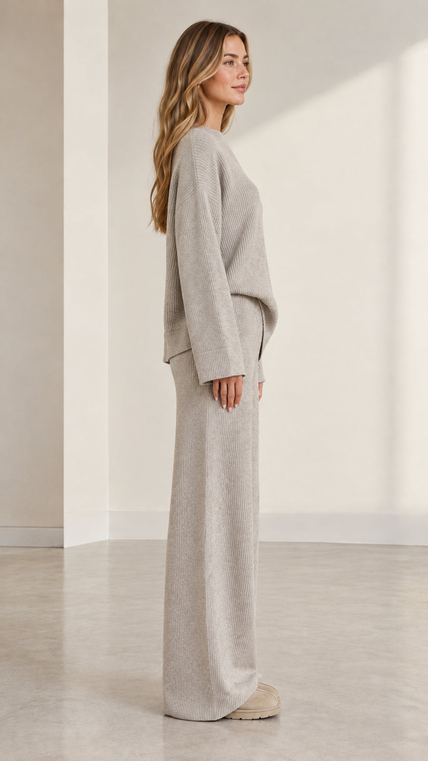 Side angle view of model wearing heather grey two-piece ribbed knit lounge set