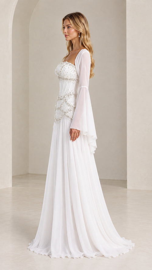 White corset formal maxi dress side view showing flowing skirt silhouette