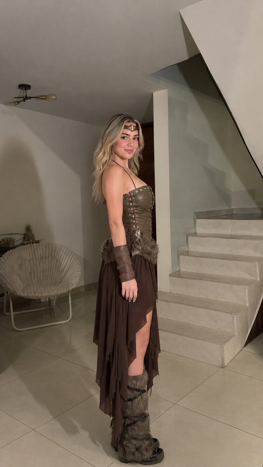 Side profile view of woman wearing the brown Viking warrior costume set showing laced corset and hi-low skirt