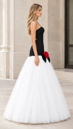 Side angle of black and white strapless corset ball gown with full tulle skirt