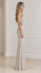 Side profile of model wearing champagne embellished maxi dress