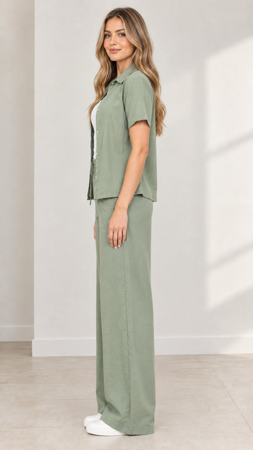 Side angle view of model wearing Sage Green casual two-piece pant set