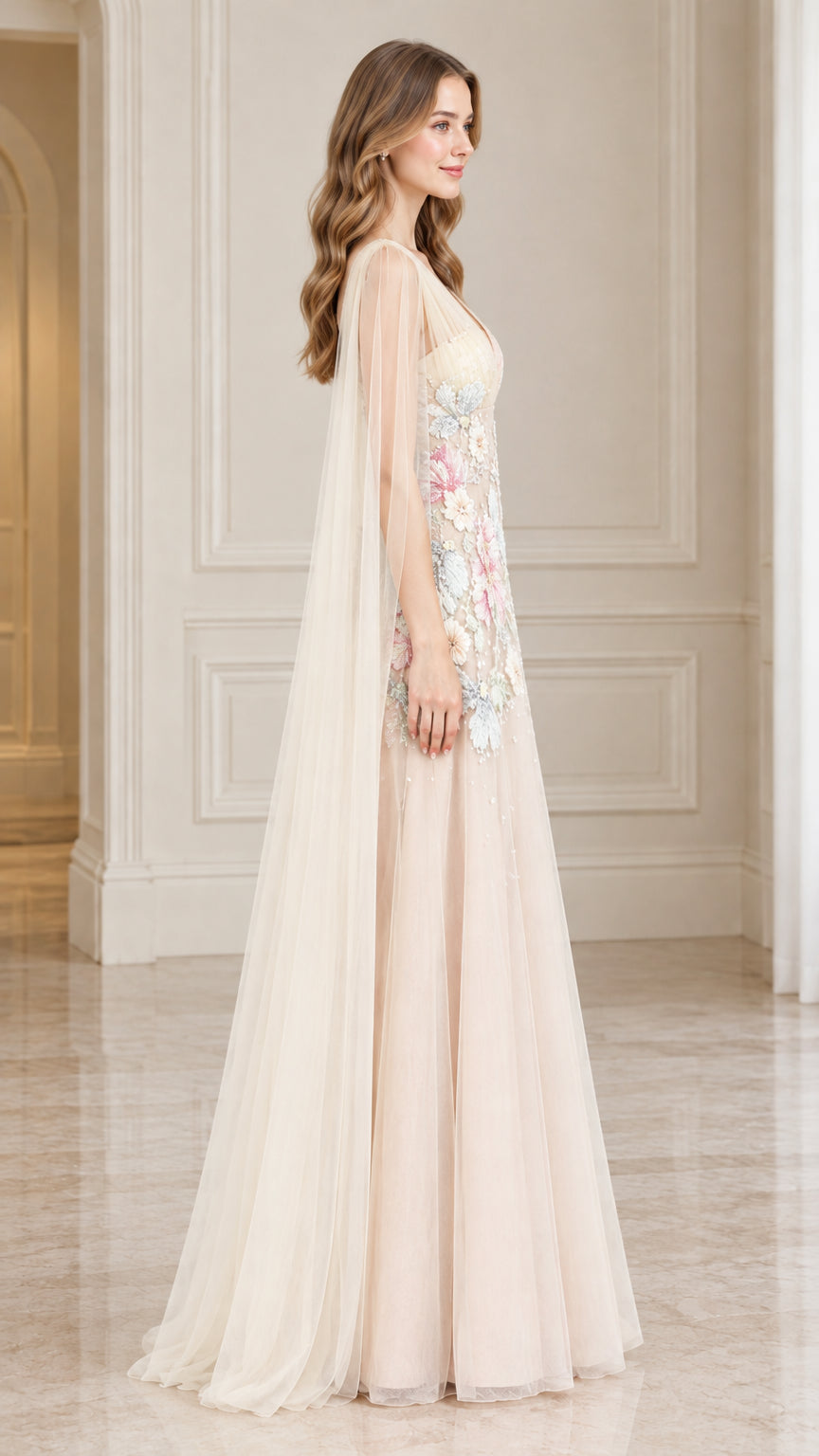 Side profile of Champagne tulle formal dress showing cape draping and embroidery