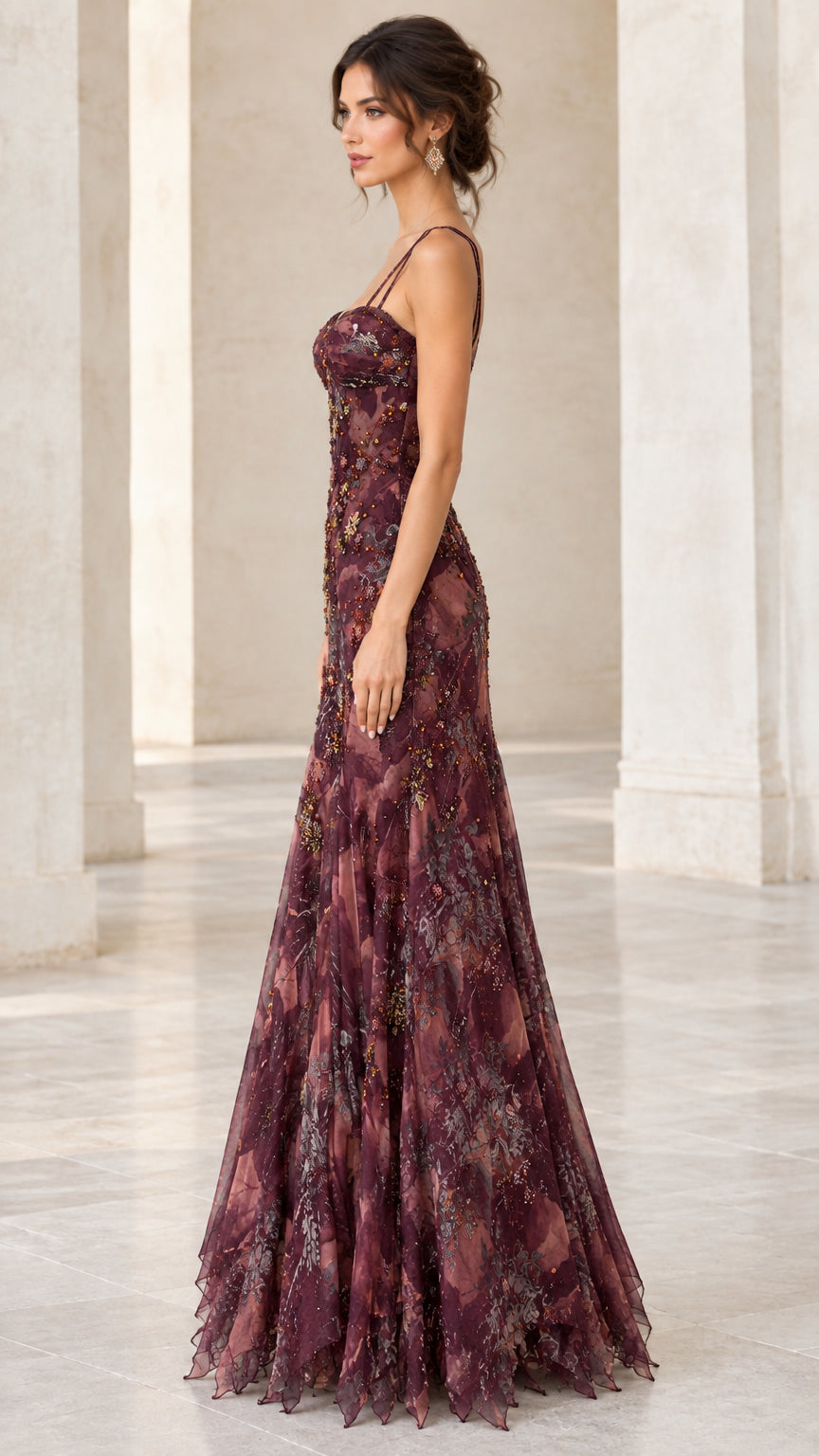 Side profile view of woman modeling the burgundy floral maxi evening gown