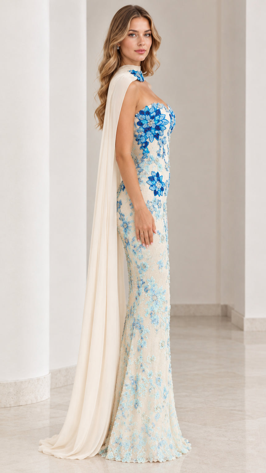 Side profile of ivory formal dress showcasing fitted silhouette and draped one-shoulder cape