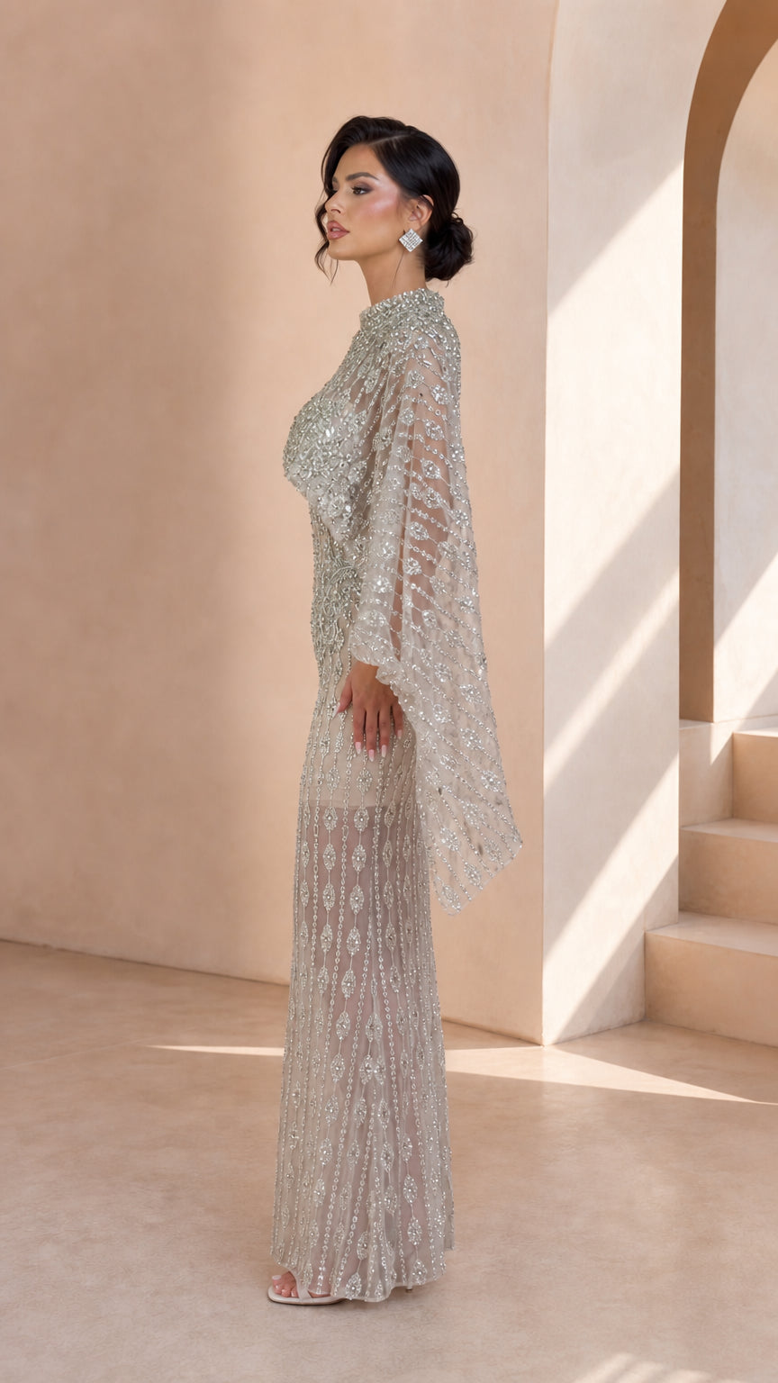Side profile view of Silver Embellished Cape Sleeve Maxi Gown