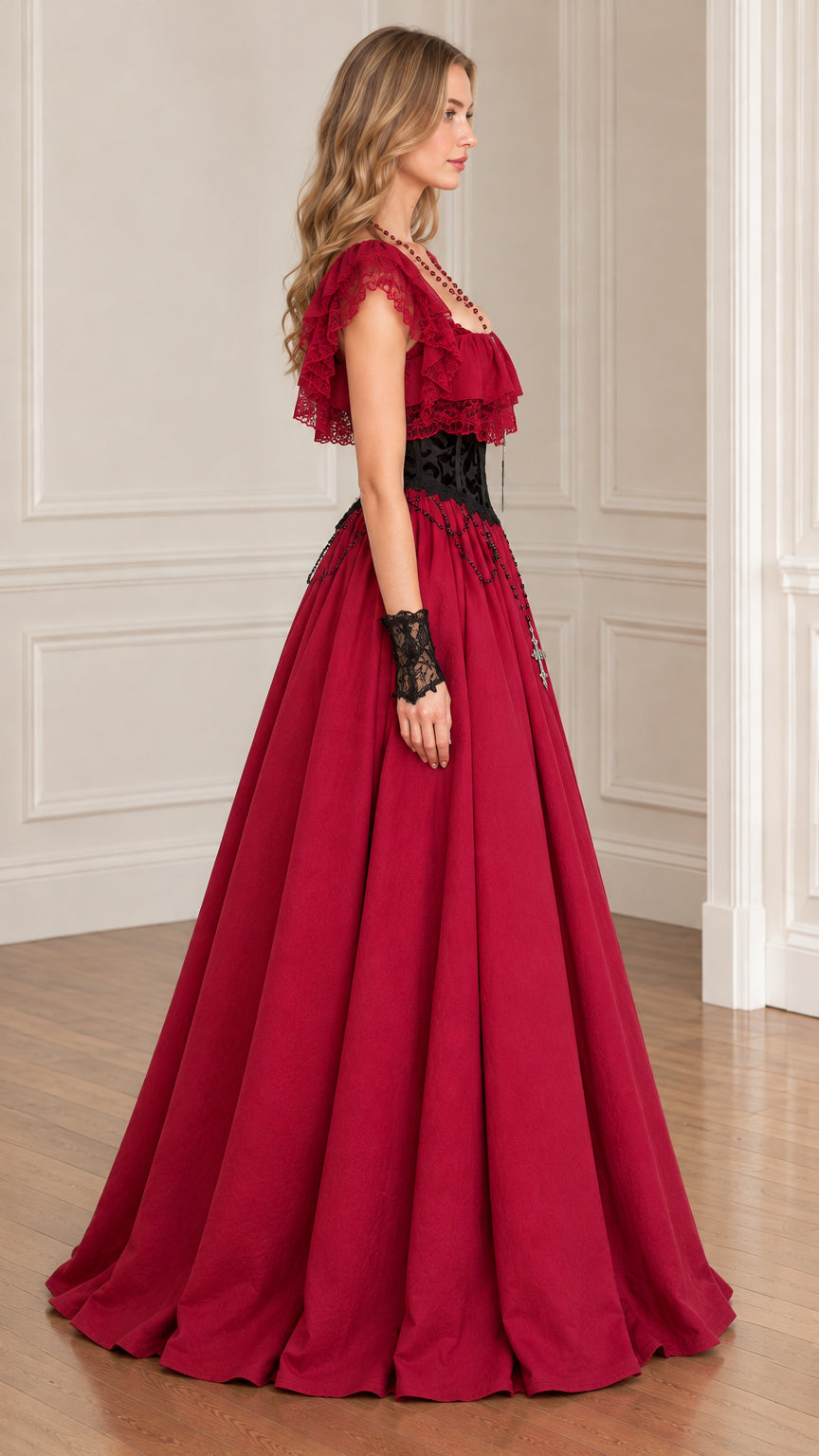 Side profile view of woman modeling burgundy ruffle lace maxi ball gown