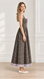 Side profile view of brown floral lace-up maxi dress