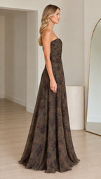 Side profile of woman in strapless olive floral evening dress