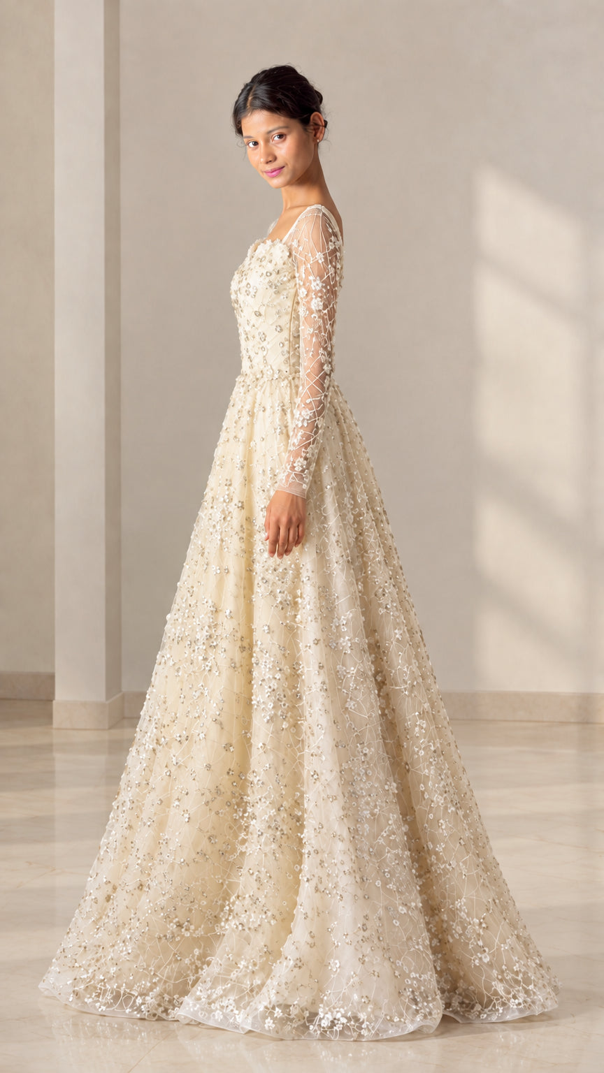 Champagne embellished long sleeve evening gown side profile