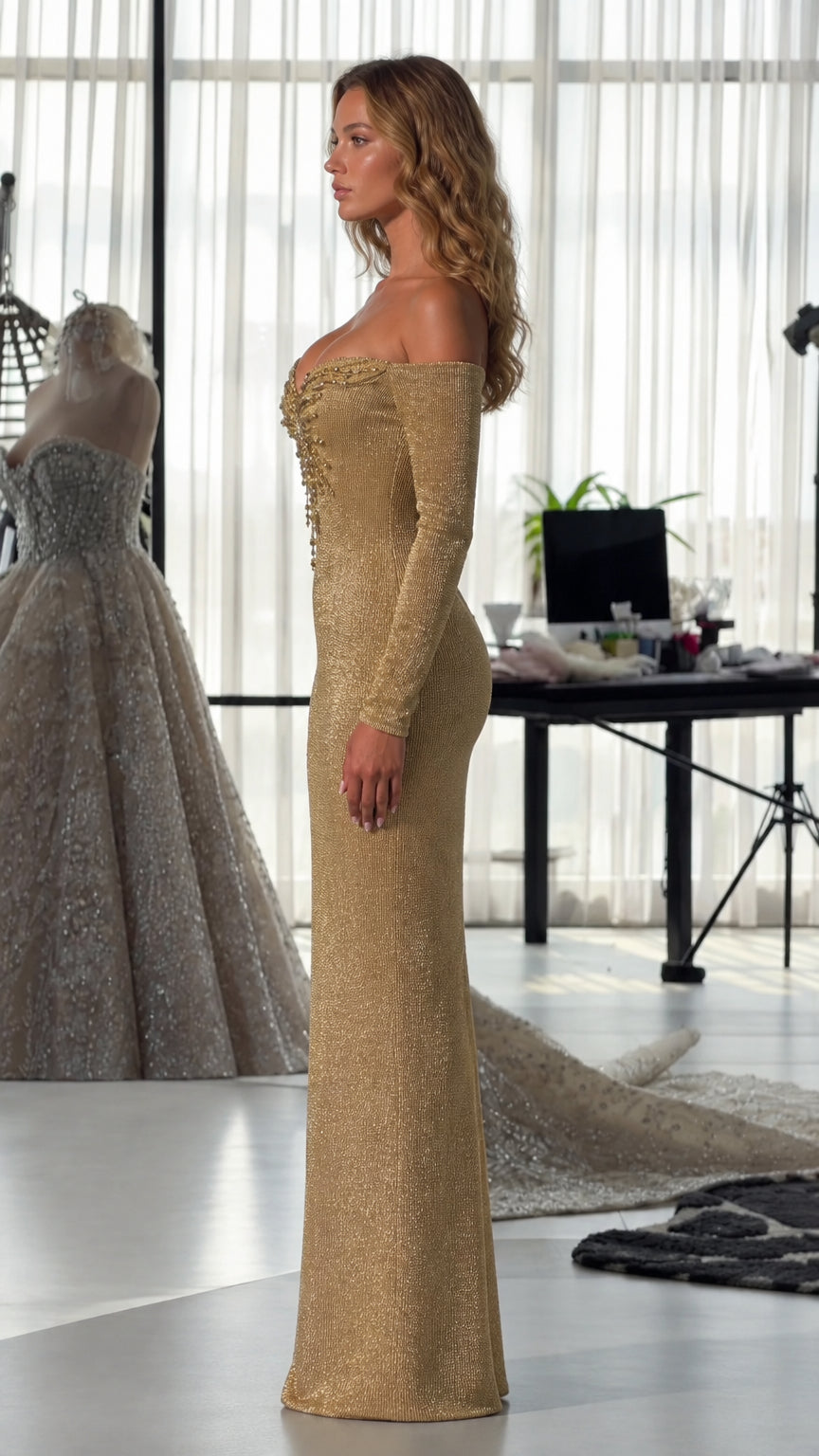 Side view of model wearing gold long-sleeve glitter evening gown