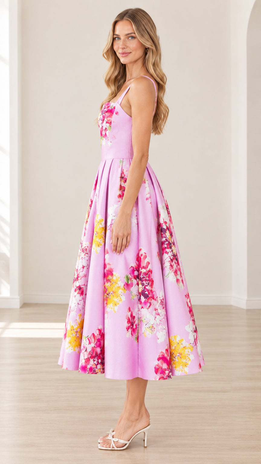 Side profile of model wearing pink floral sleeveless midi dress