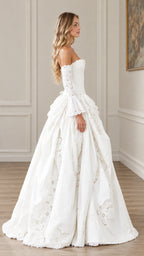 Side profile view of white off-the-shoulder corset ball gown showing volume and bell sleeves
