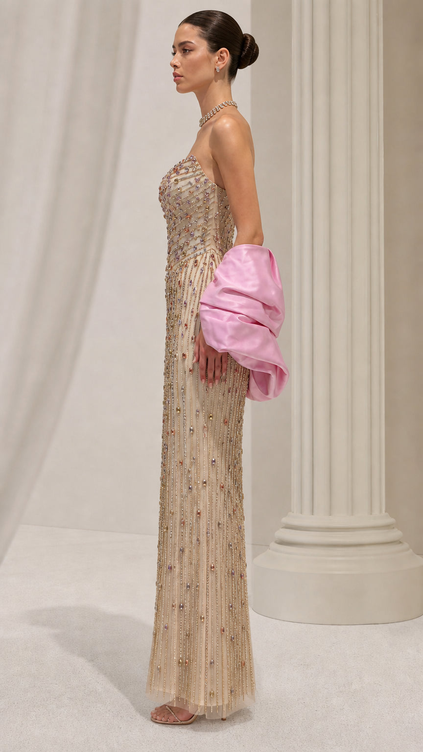 Side profile view of champagne crystal embellished strapless formal dress