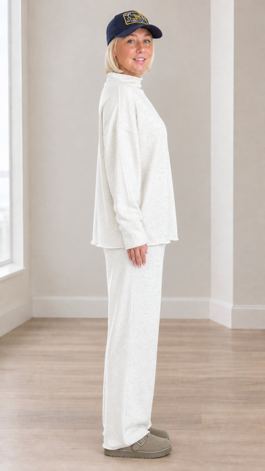 Side profile view of model in oatmeal two-piece casual lounge set