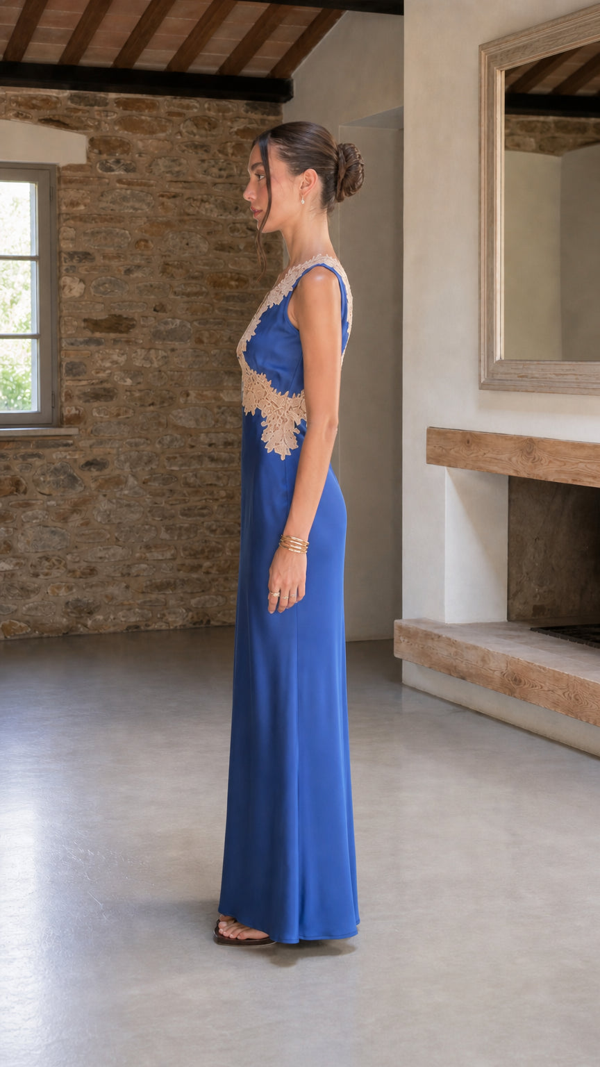Side view of royal blue sleeveless lace-trimmed satin evening dress