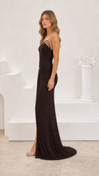 Side profile view of model posing in espresso shimmer strapless formal dress