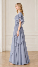 Side profile view of dusty blue cascading ruffle A-line formal gown
