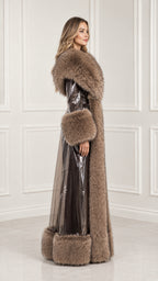 Side profile of woman in taupe brown high-shine floor-length coat with thick fur trim