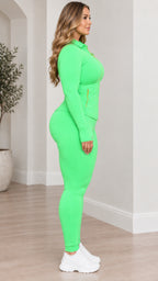 Side profile view of model wearing lime green two-piece activewear set