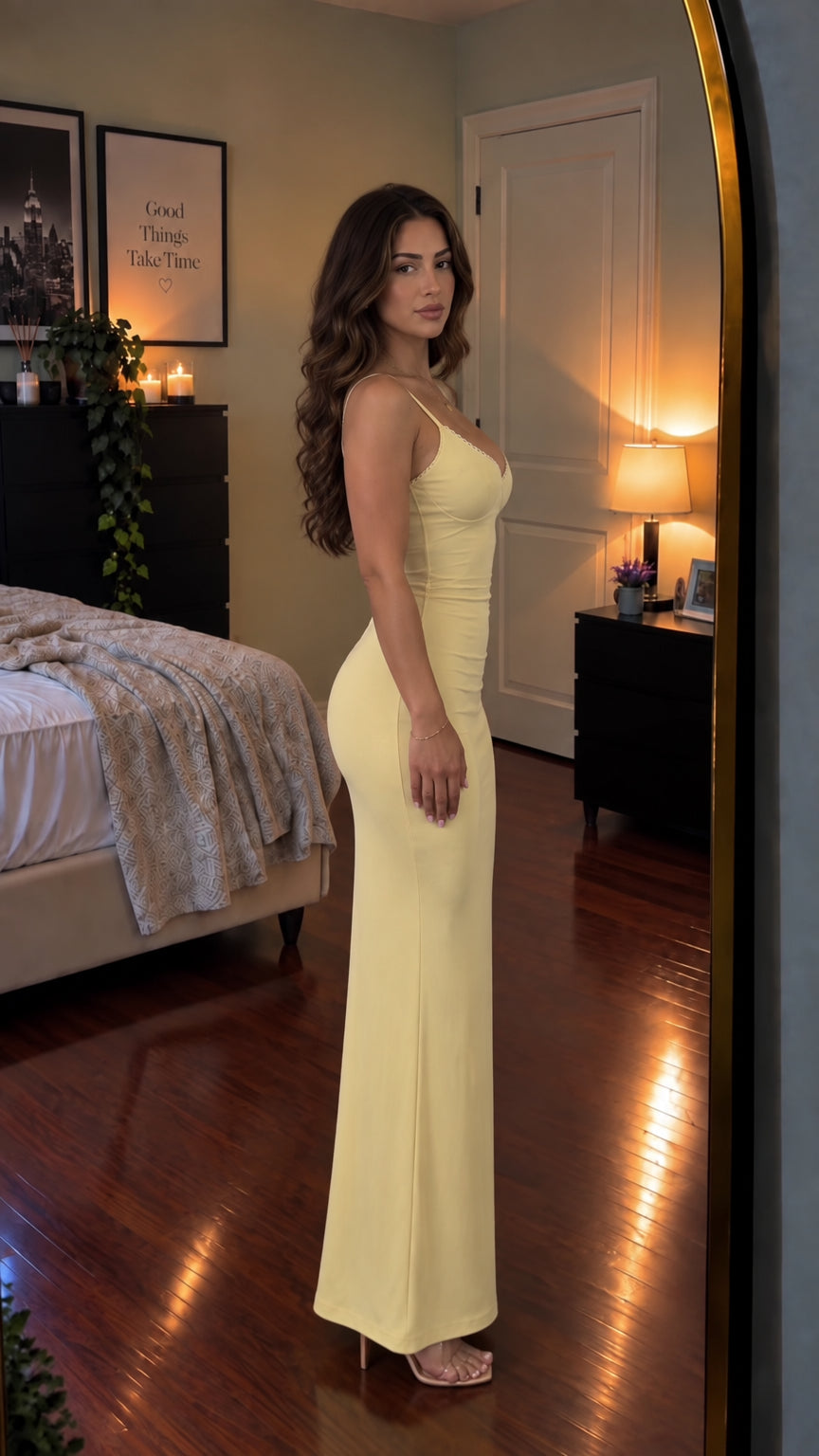 Side profile view of woman modeling Butter Yellow bustier cami maxi dress