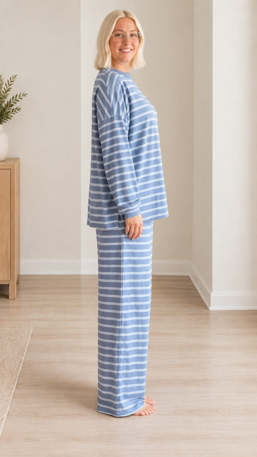Side view of woman wearing blue striped two-piece loungewear set