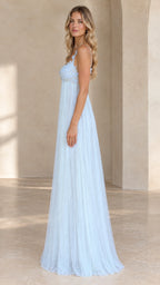 Side profile of model in light blue tulle maxi evening dress showing flowing silhouette