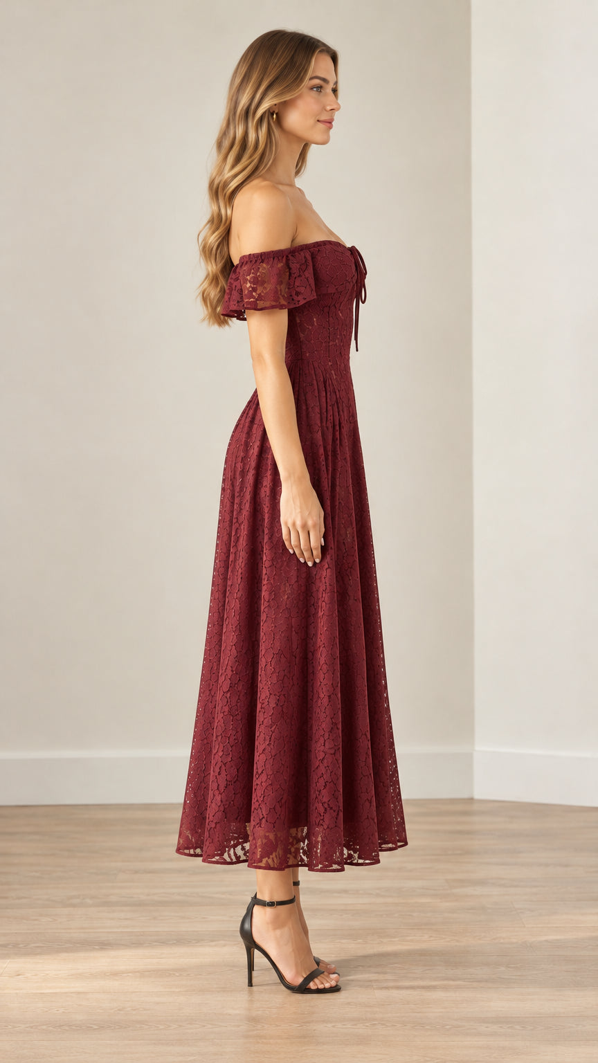 Side profile of model wearing a burgundy off-the-shoulder floral lace midi dress