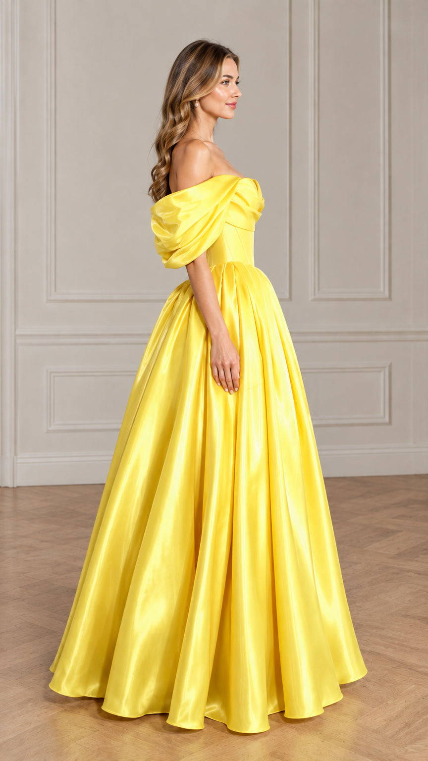 Side profile of model in yellow satin off-shoulder formal evening maxi gown
