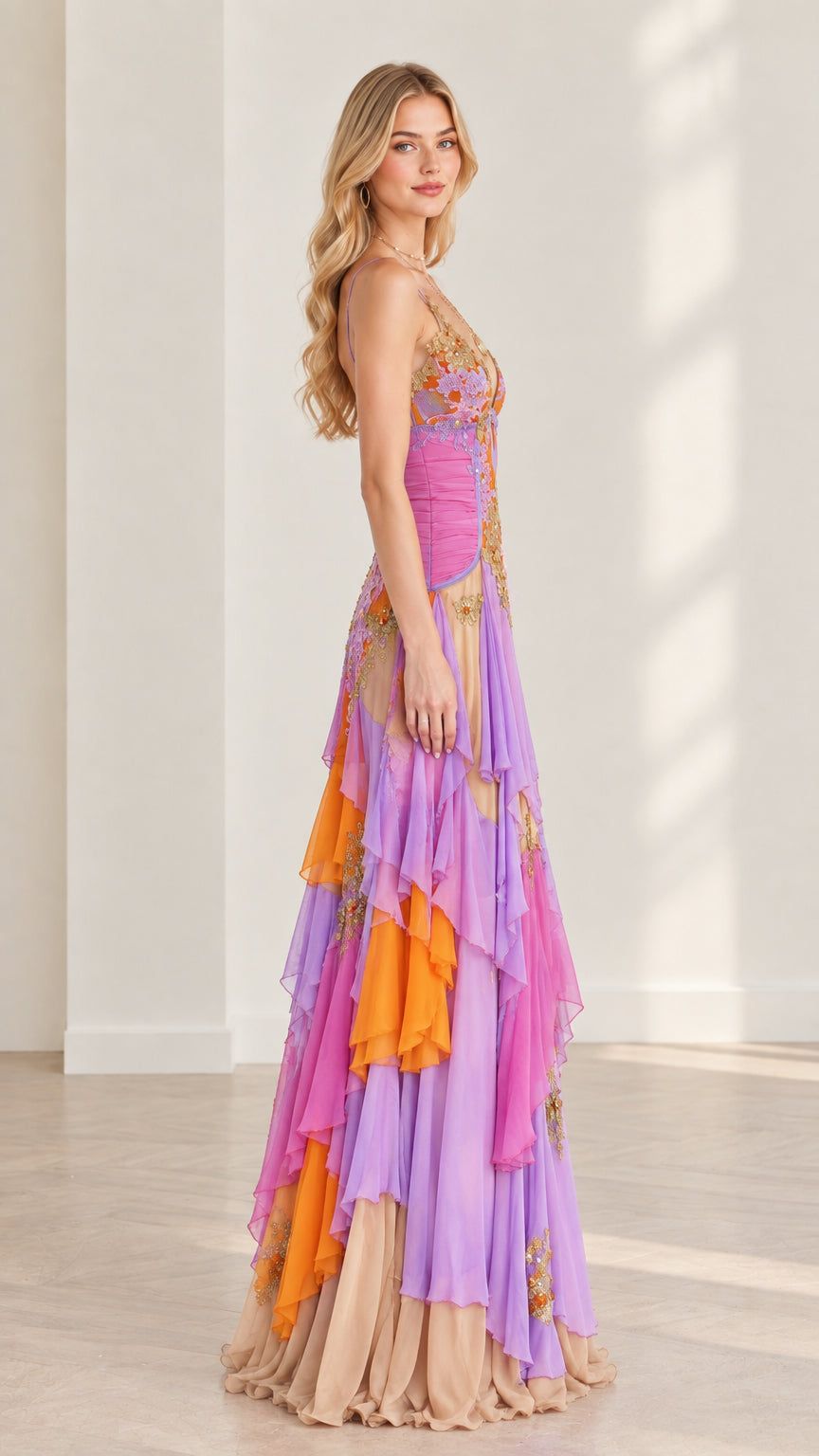 Side angle view of model wearing vibrant multicolor layered chiffon evening dress