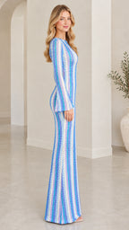 Side profile of model in Blue Multi long sleeve chevron knit maxi dress