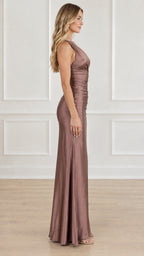 Side profile view of a woman wearing a dusty mauve ruched one-shoulder evening gown