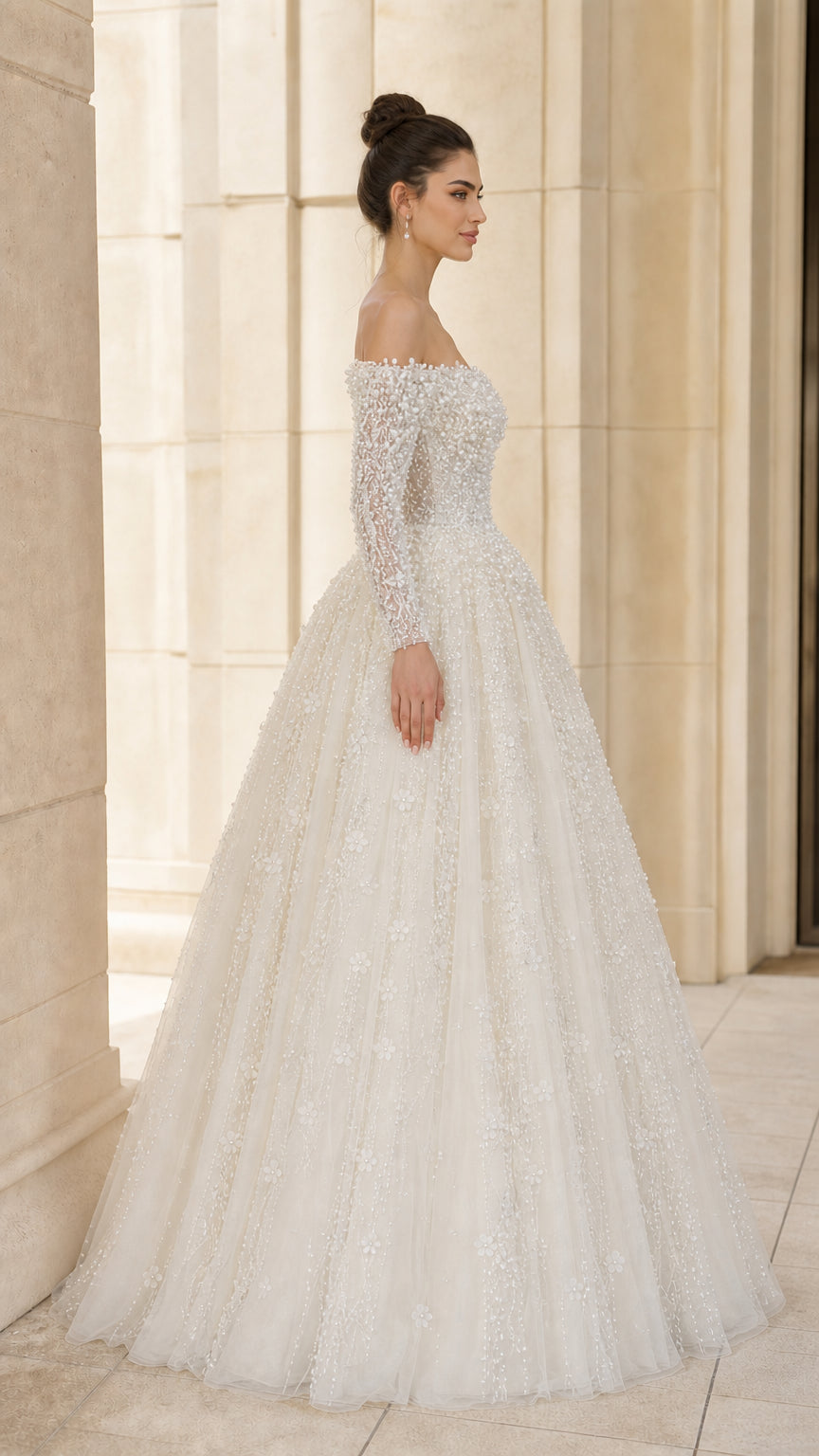 Side profile of ivory beaded tulle formal wedding dress