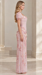 Side profile view of pink floral beaded corset evening maxi dress