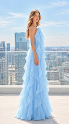 Side profile of woman in light blue cascading tiered ruffle evening dress