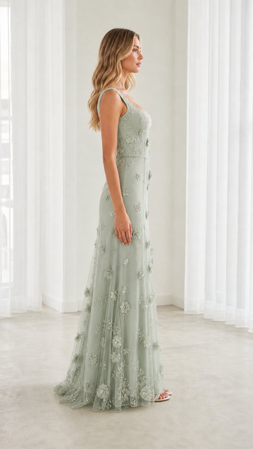 Side full-length profile of model wearing Sage Green 3D floral appliqué formal dress