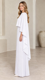 Side profile view of woman wearing white pleated cape maxi dress