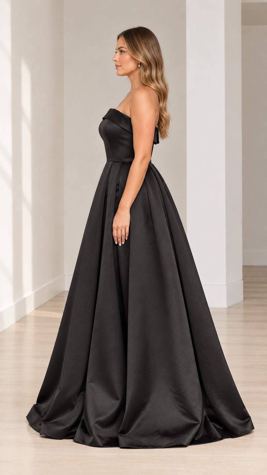 Side profile view of black strapless satin ball gown showcasing full-length silhouette