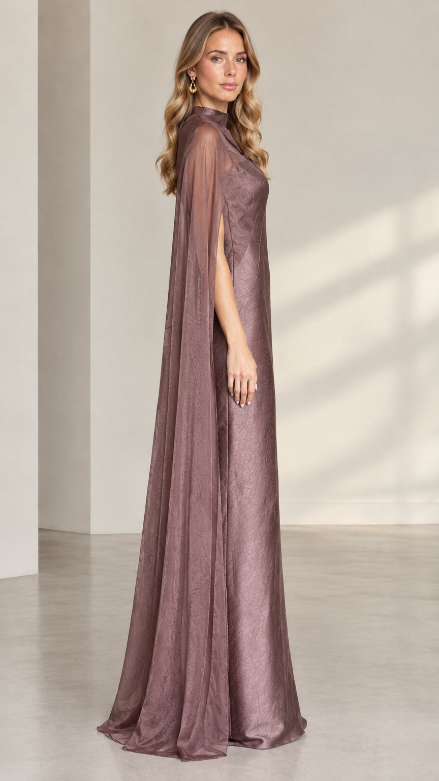 Side profile of dusty mauve cape overlay maxi dress showing arm slit detail