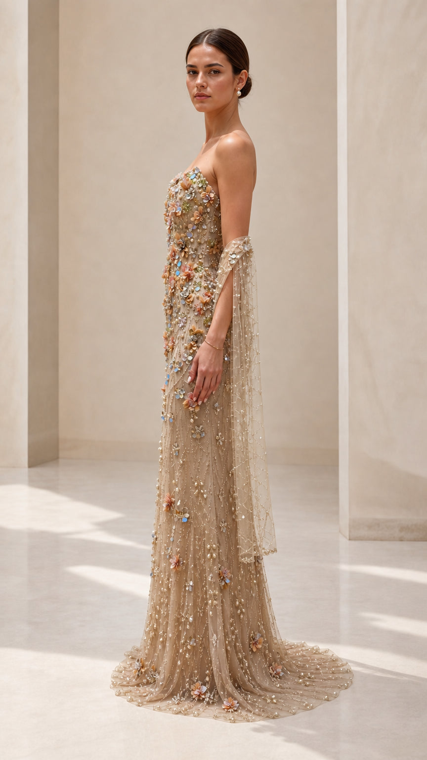 Side profile view of champagne floral beaded formal maxi gown with train