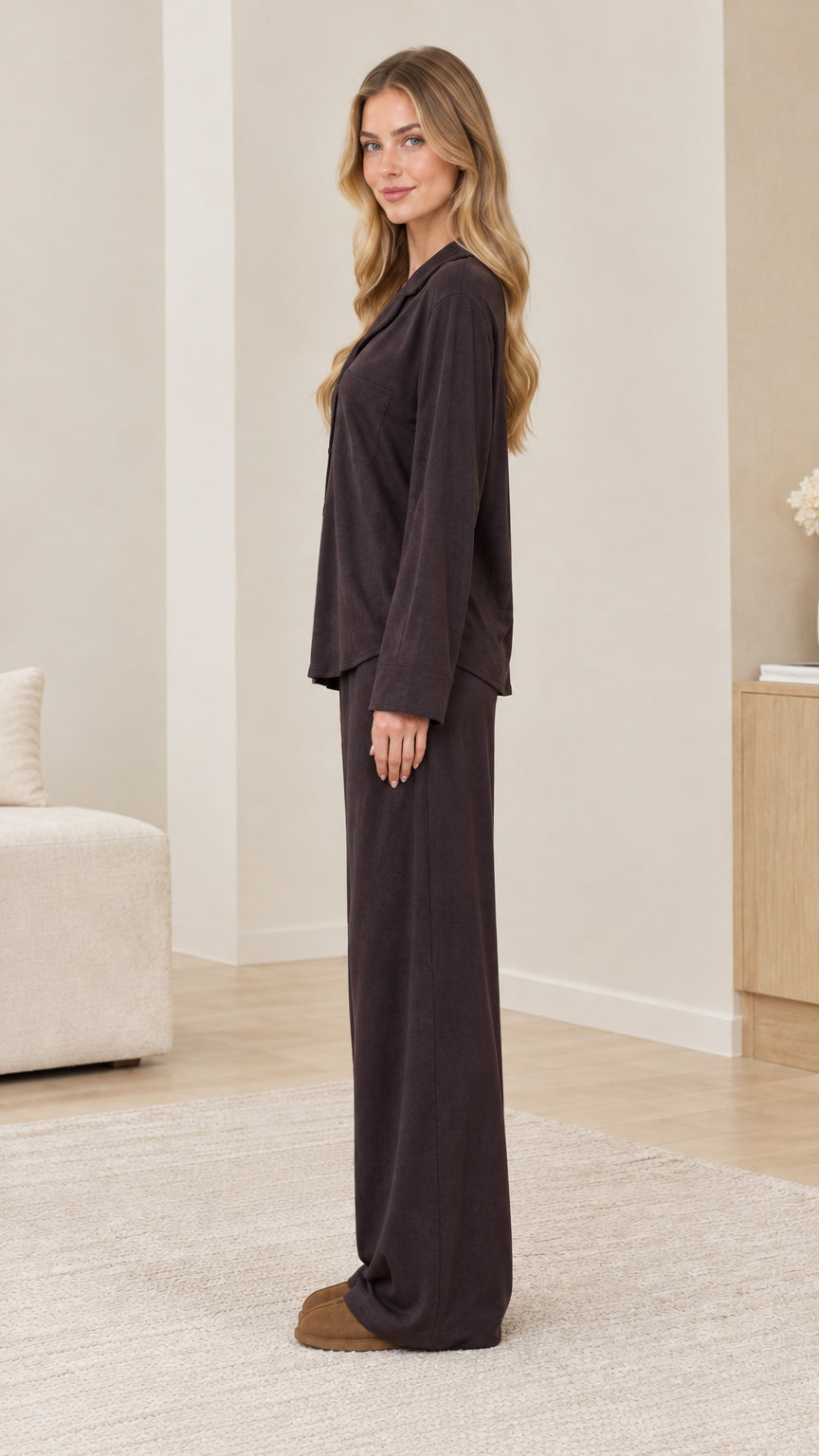 Side profile view of model wearing dark brown relaxed fit pajama set
