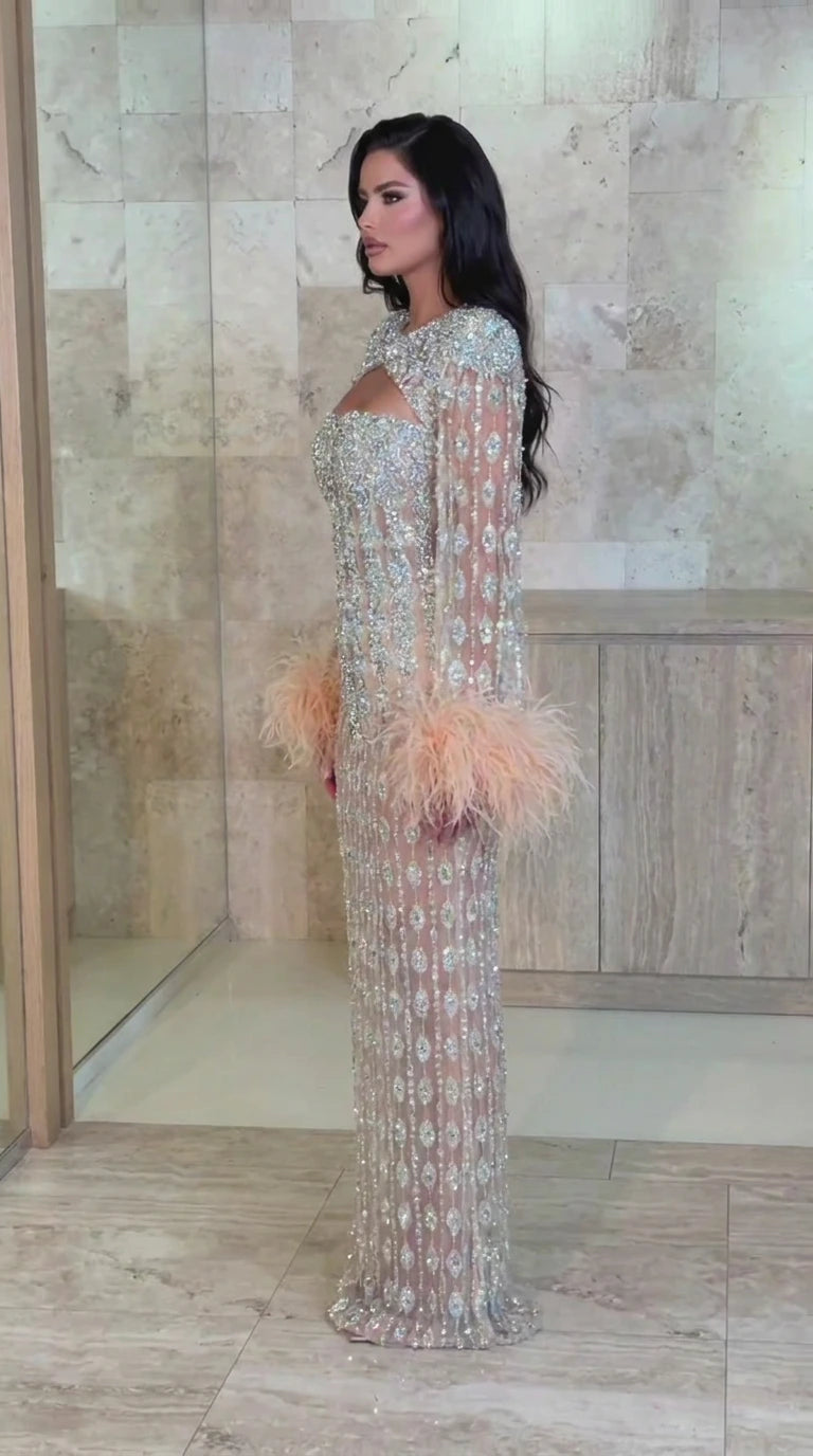 Side profile of Champagne beaded floor-length gown