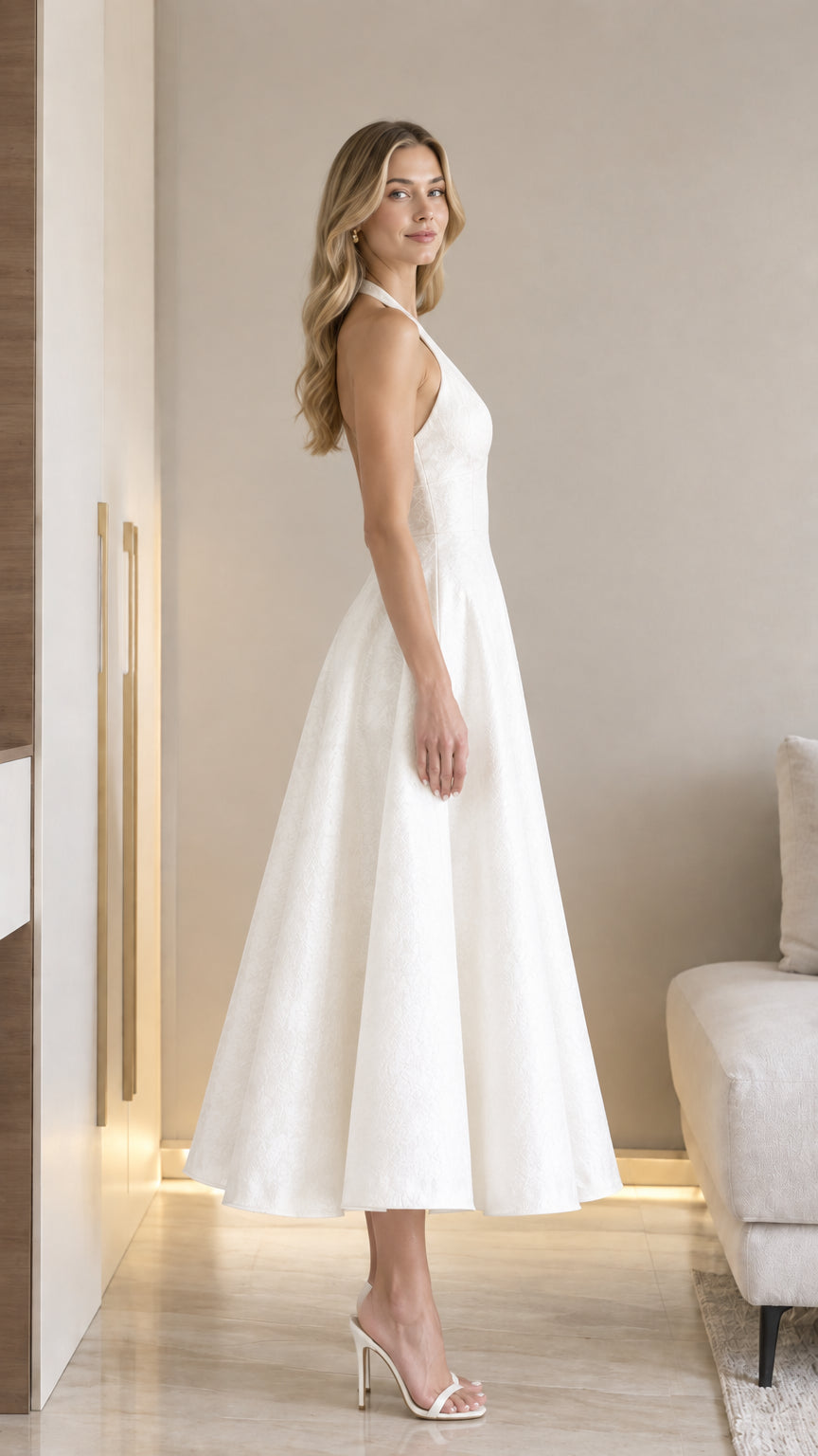 Side view of model wearing white halter V-neck jacquard A-line midi dress