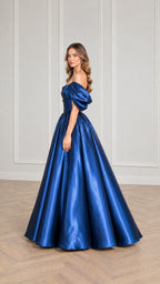 Side profile view of woman wearing royal blue satin off-the-shoulder evening gown
